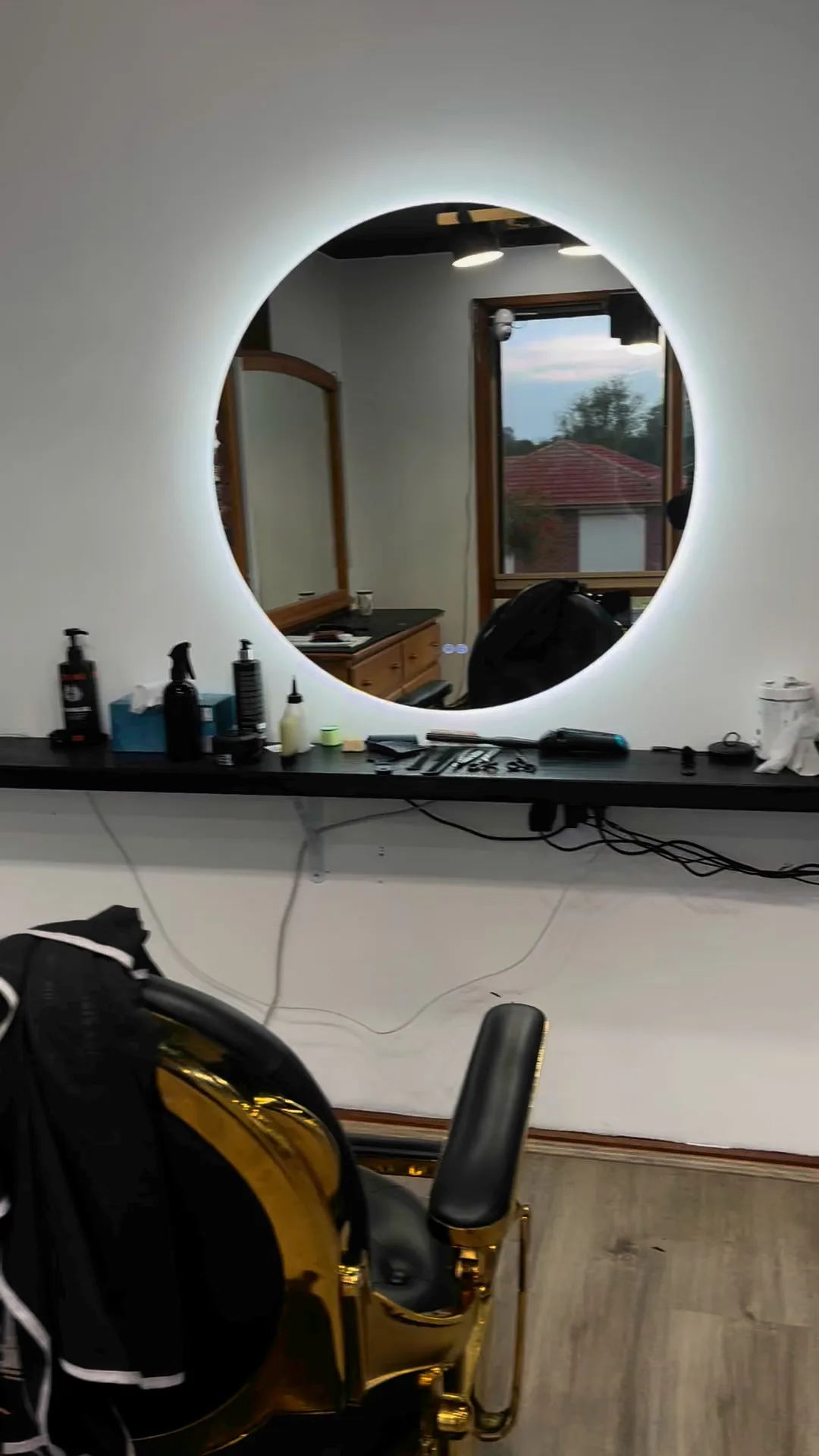 GKF Barber interior — gold chair, backlit mirror, Camberwell
