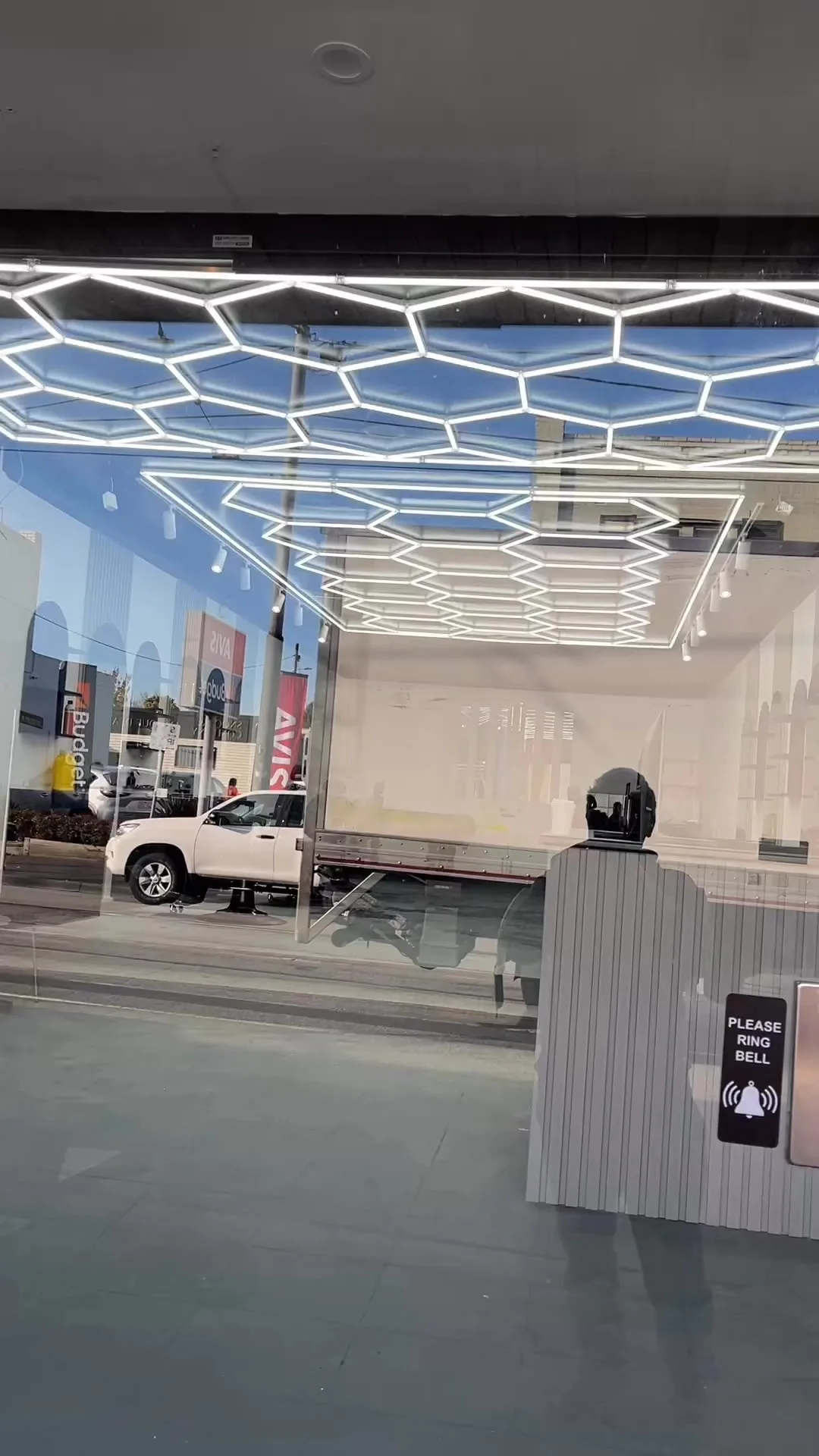 GKF Barber shopfront — 404 Burke Road Camberwell, hexagonal honeycomb LED ceiling visible through the glass